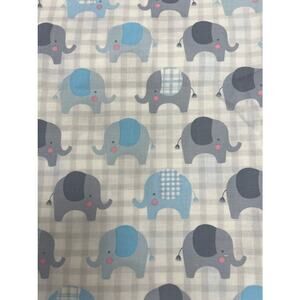 blue and gray elephant fabric, with white background. Baby quilt